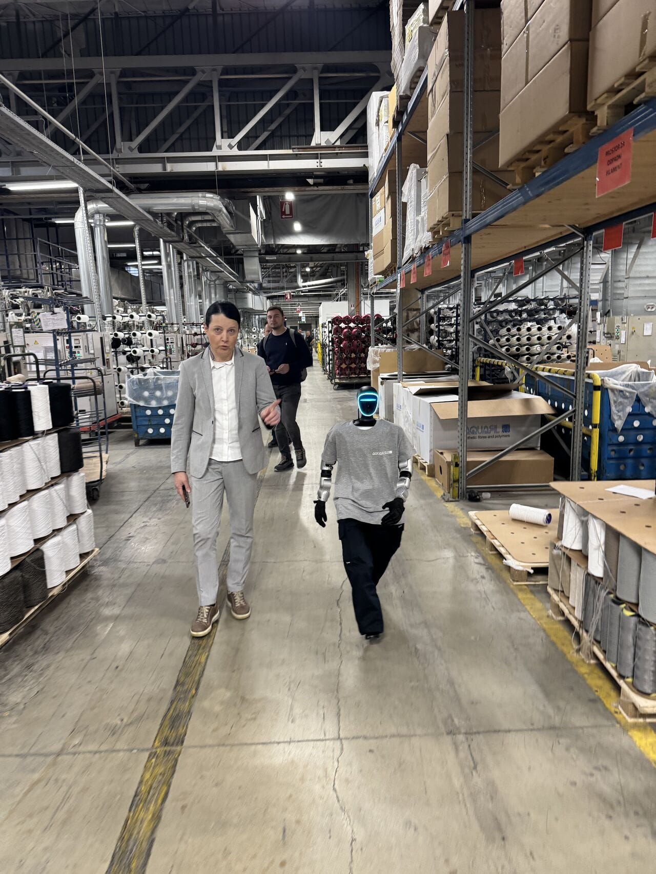 Humanoid robot Jože walking through the AquafilSLO warehouse