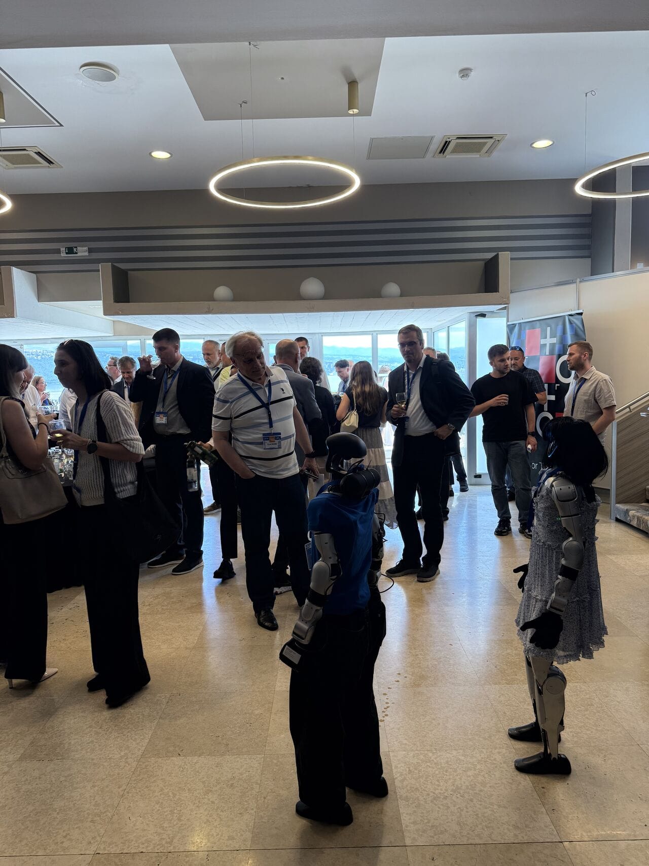 Visitors talking with the humanoid robots at the Vandri Robotics corner
