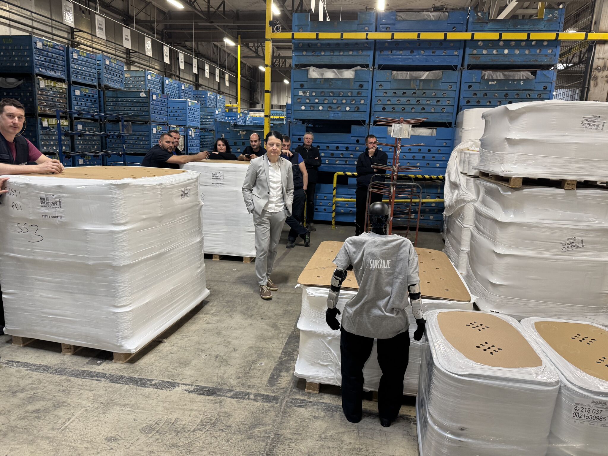 Humanoid robot Jože with the Aquafil team in the Celje production facility