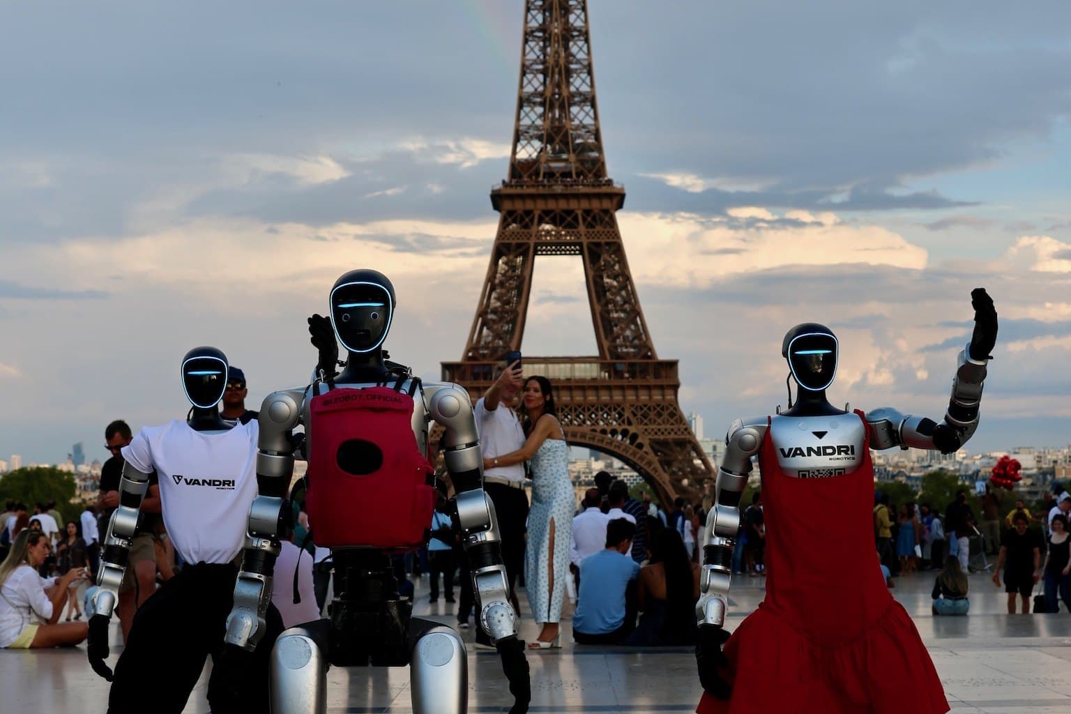 Jože, Tonka and Leo, a humanoid robot from Paris, beneath the Eiffel Tower