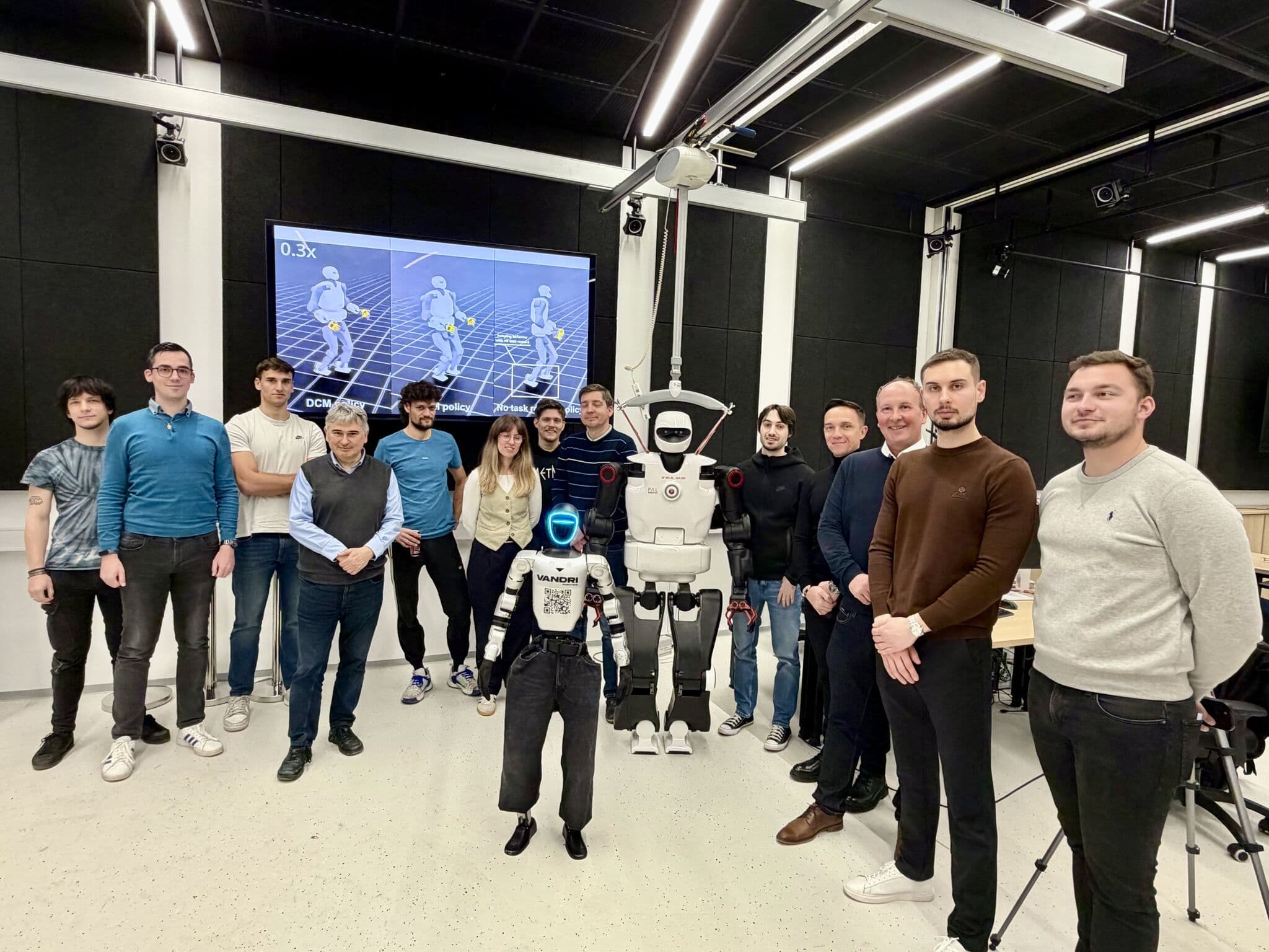 Vandri Robotics team with researchers and the Talos humanoid robot at the Jožef Stefan Institute