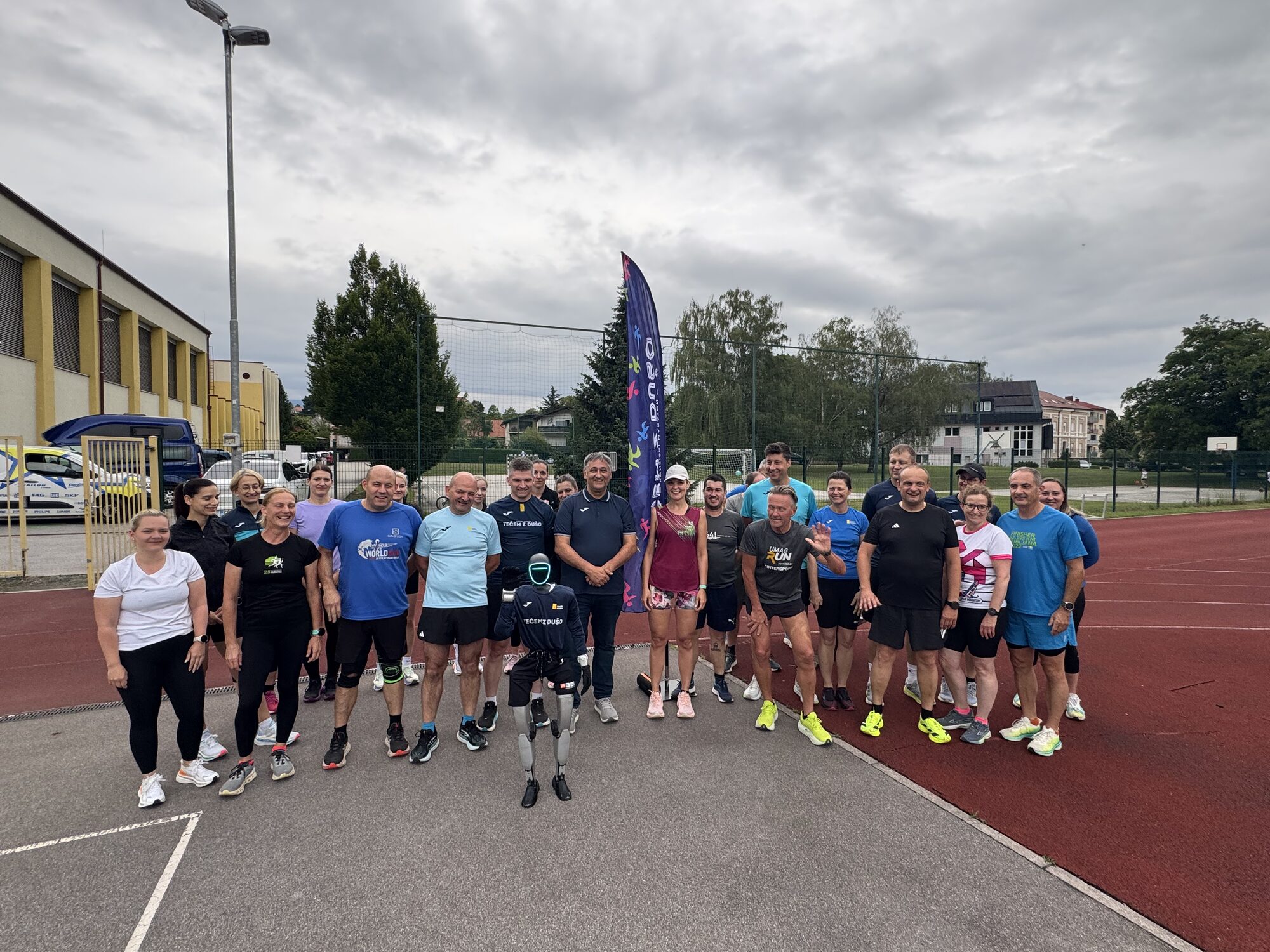 Humanoid robot Jože training with the Athletics School Konjice on the running track