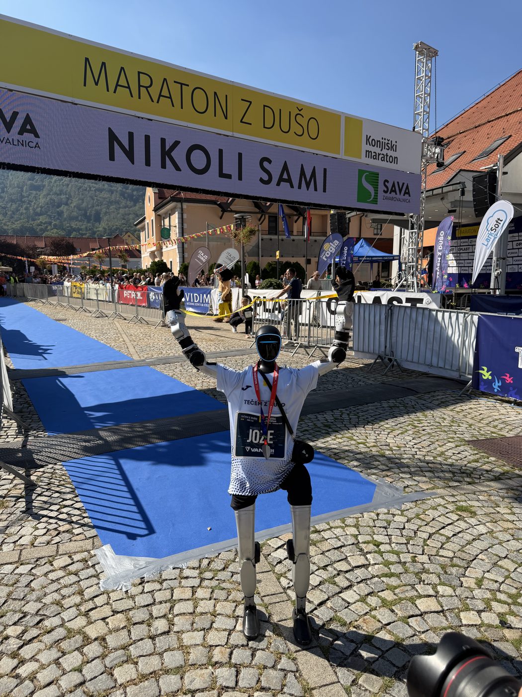 Jože with raised arms at the finish of the Konjice Marathon