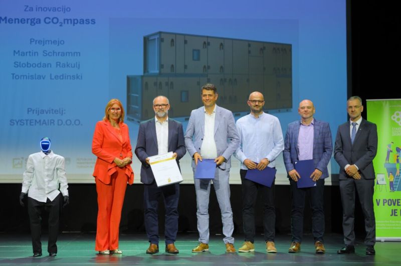 Award handover at the Podravje Innovation Awards with humanoid robot Jože on stage